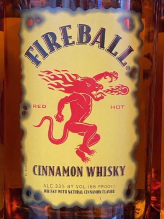 A close up of a bottle of fireball cinnamon whisky