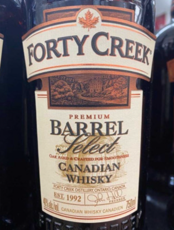 A bottle of forty creek premium barrel select canadian whisky