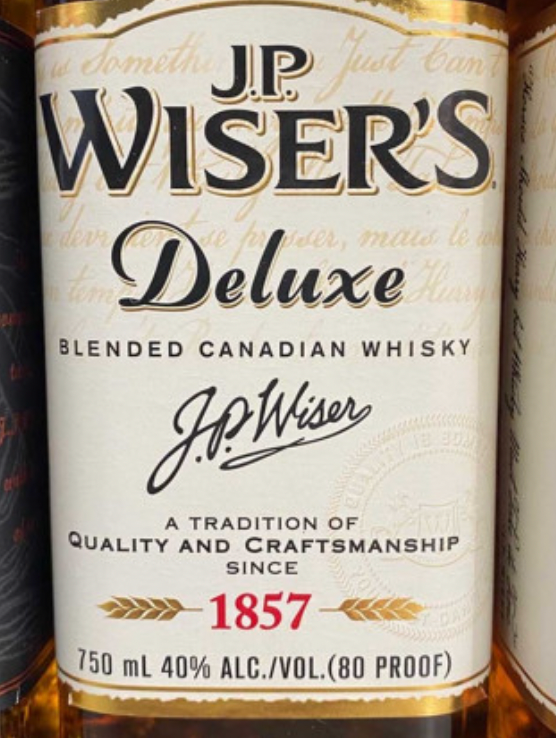 A bottle of jp wiser 's deluxe blended canadian whisky