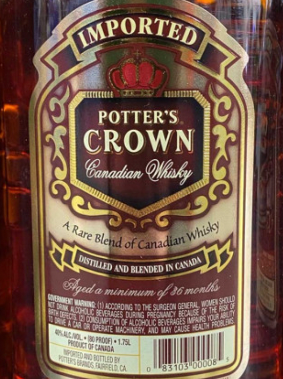 A bottle of imported potter 's crown canadian whisky