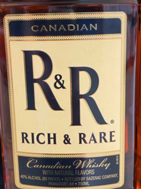 A bottle of r & r canadian whiskey with natural flavors