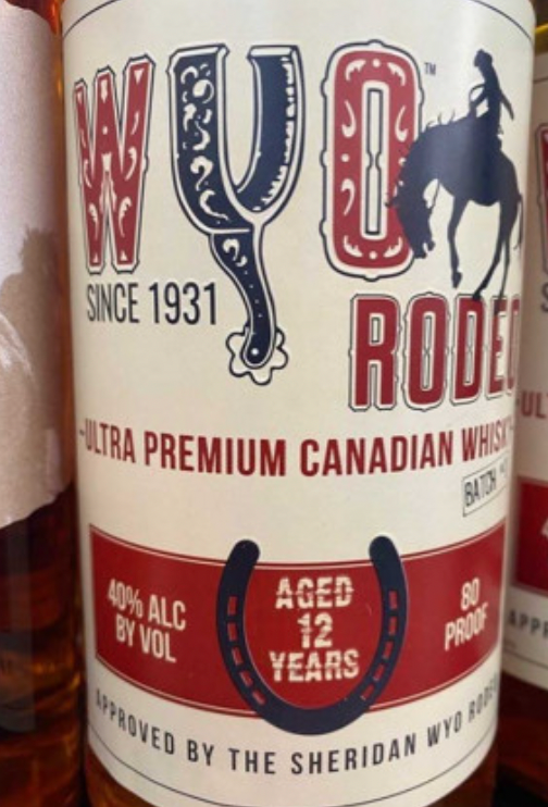 A bottle of whiskey has a horseshoe on the label