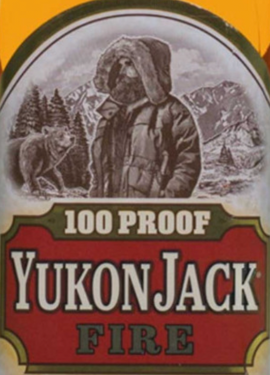 A bottle of yukon jack fire has a bear on the label