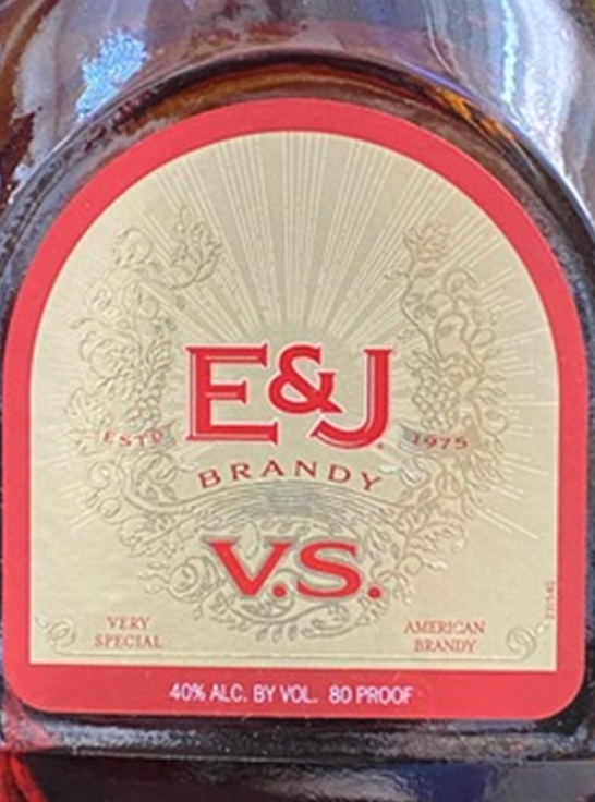 A bottle of e & j brandy has a red label