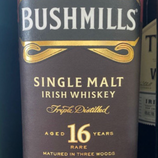 A bottle of bushmills single malt irish whiskey aged 16 years