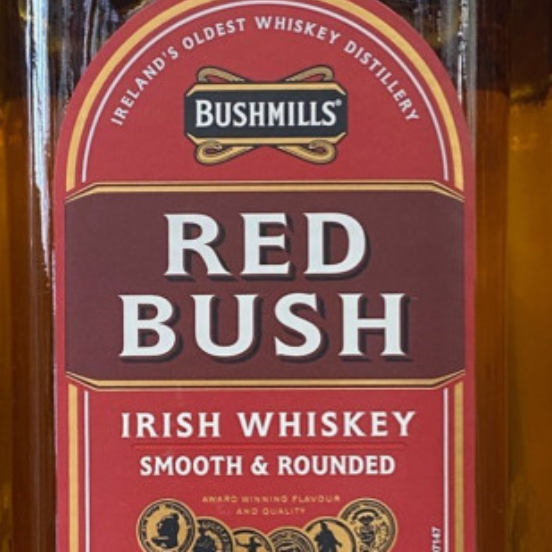 A bottle of bushmills red bush irish whiskey