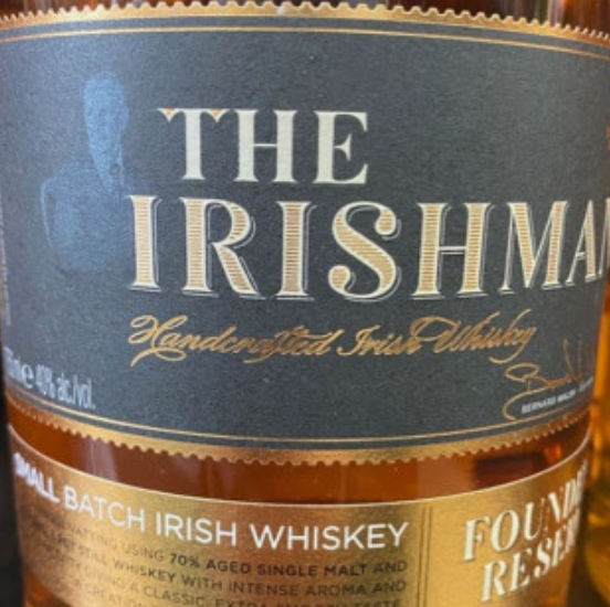 A close up of a bottle of the irishman whiskey