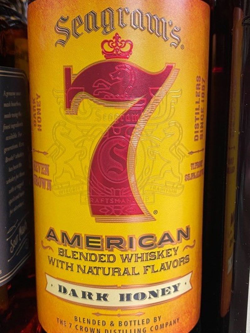 A bottle of seagrams american blended whiskey with natural flavors