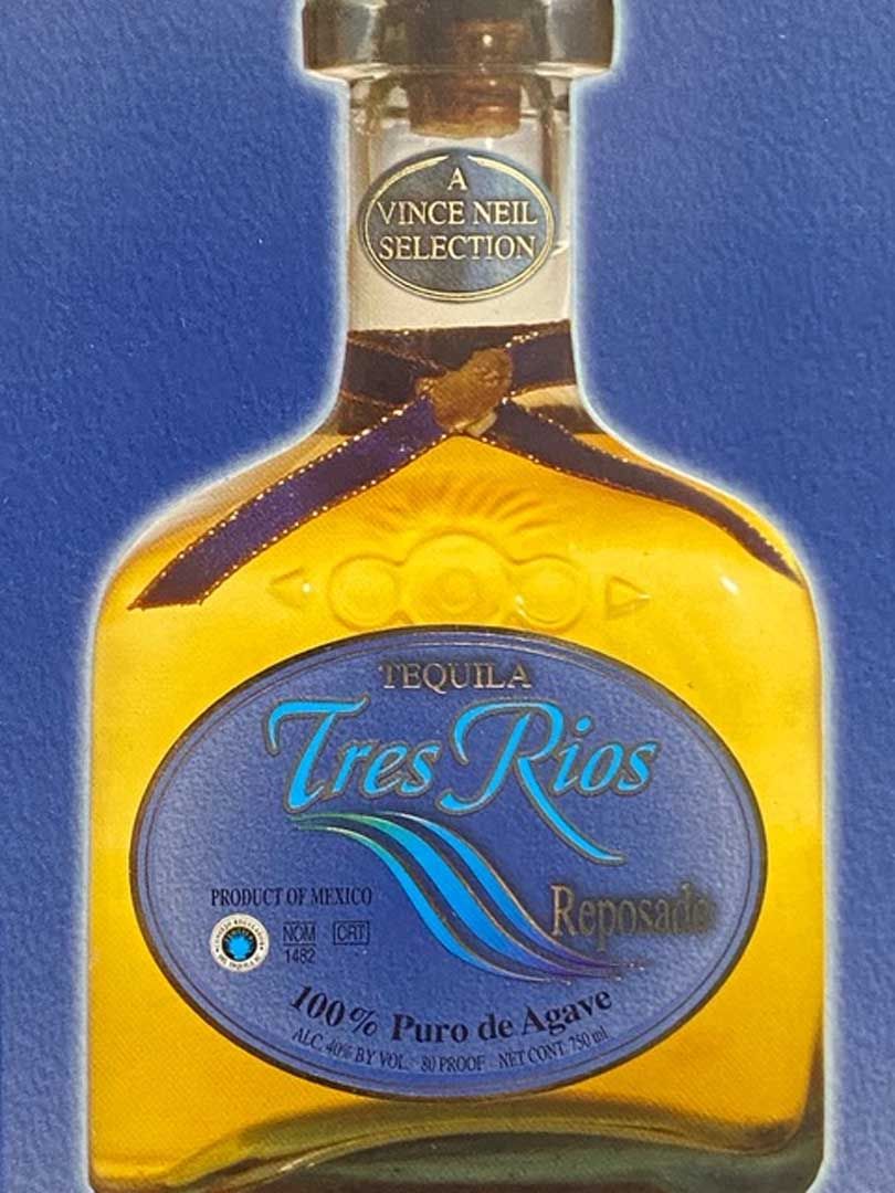 A bottle of tres rios tequila on a blue background