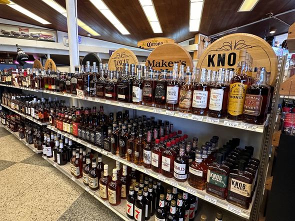 A liquor store filled with lots of bottles of liquor.