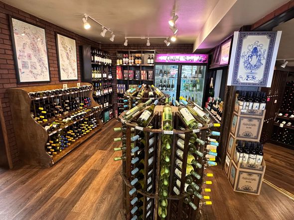 A wine store filled with lots of bottles of wine.