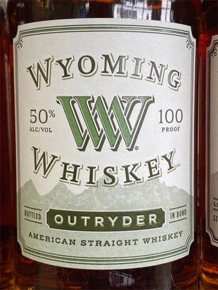 A bottle of wyoming whiskey with a green label