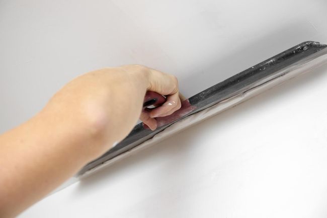 man scrubbing the walls