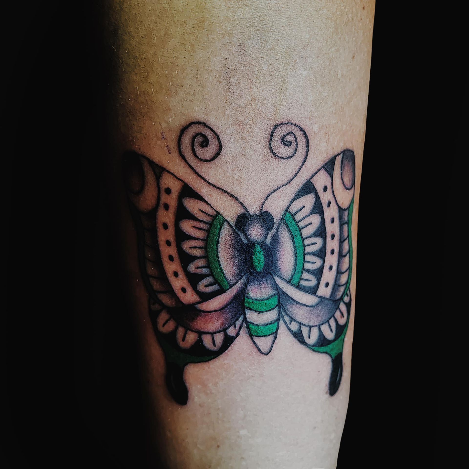 A Person Has a Tattoo of A Butterfly on Their Arm  — Thaiger Ink in Holloways Beach, QLD
