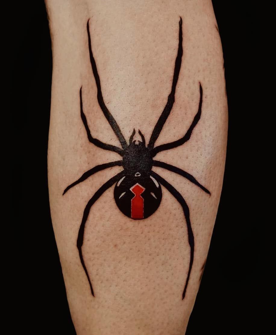 Black Widow Spider Tattoo with a red Hourglass Mark on a Person's Forearm, Against a Black Background — Thaiger Ink in Holloways Beach, QLD