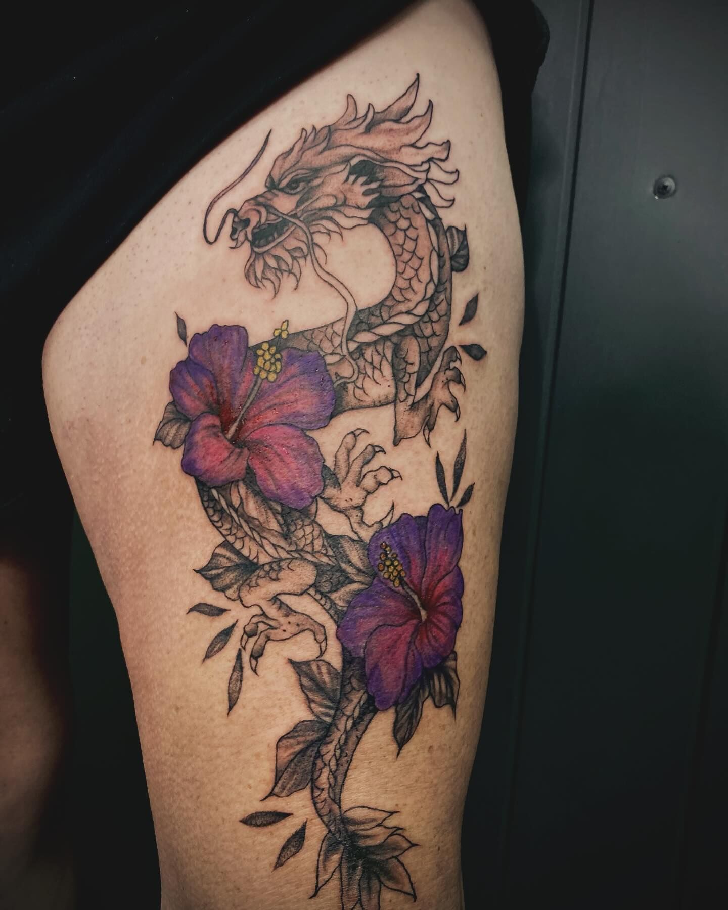 A Tattoo of A Dragon with Purple Flowers on A Person 's Leg  — Thaiger Ink in Holloways Beach, QLD