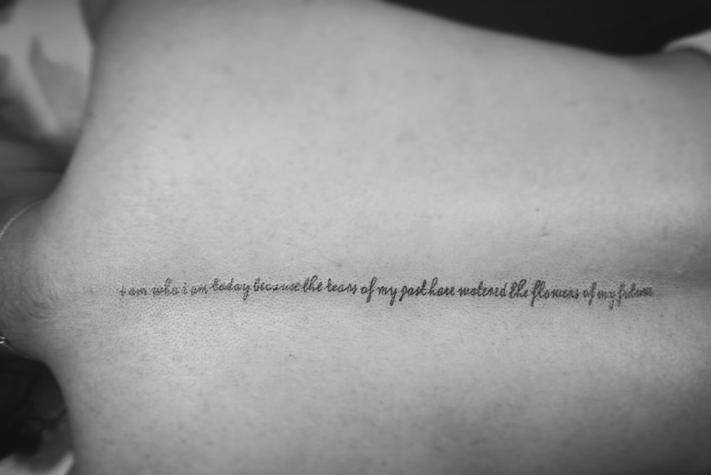 A Black and White Photo of A Person 's Back with A Tattoo on It  — Thaiger Ink in Holloways Beach, QLD