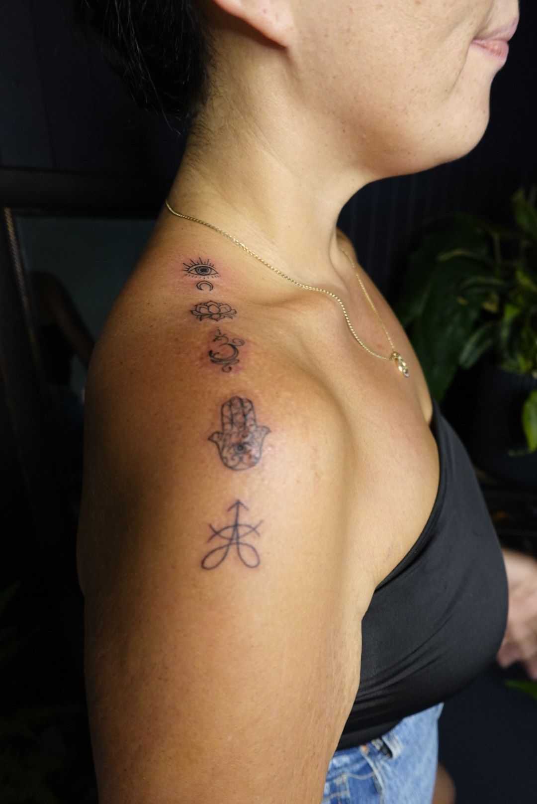 Person with Several Small Tattoos on Their Shoulder — Thaiger Ink In Holloways Beach, QLD