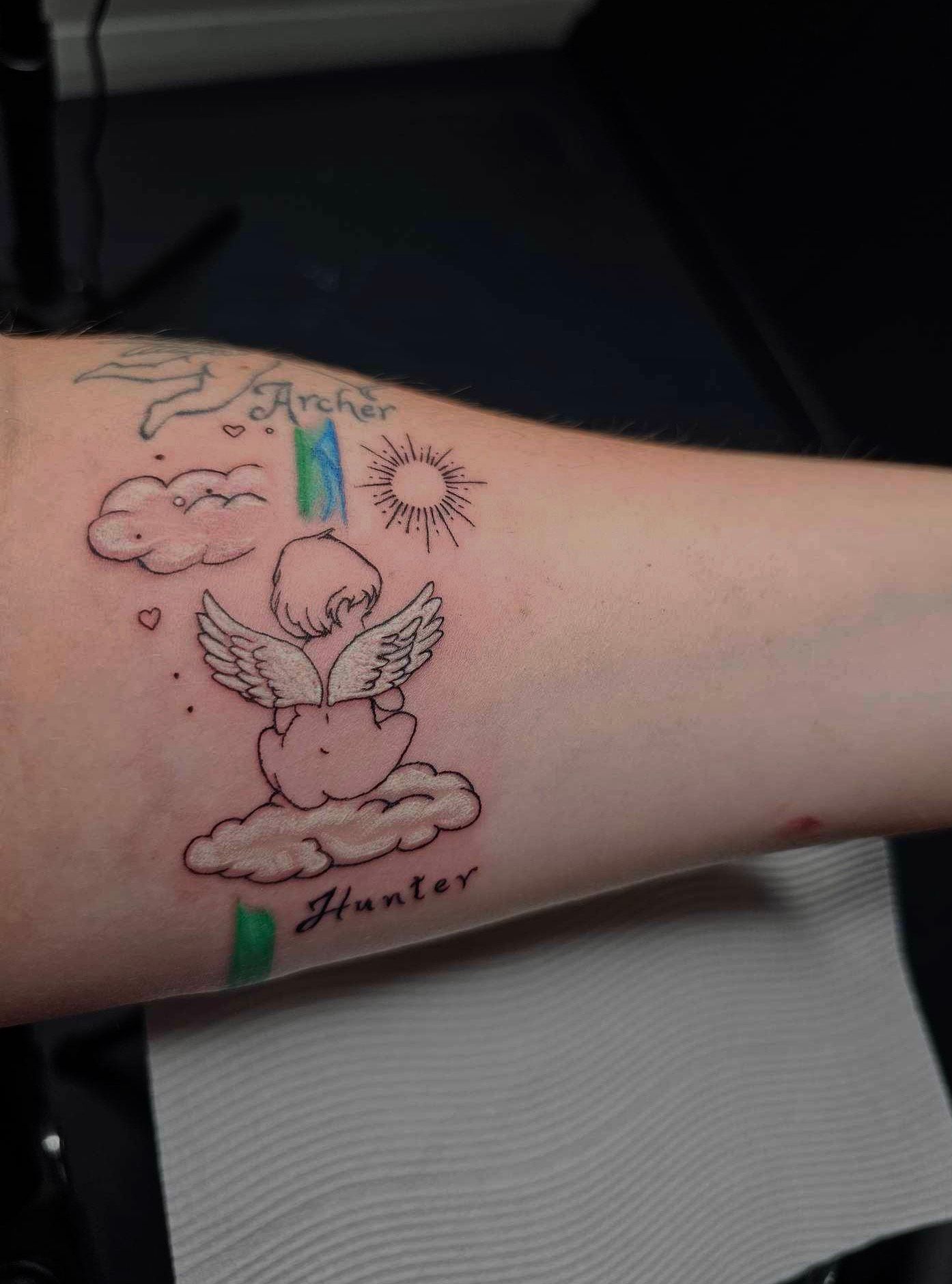 A Man Has a Tattoo of A Lotus Flower on His Back — Thaiger Ink in Holloways Beach, QLD