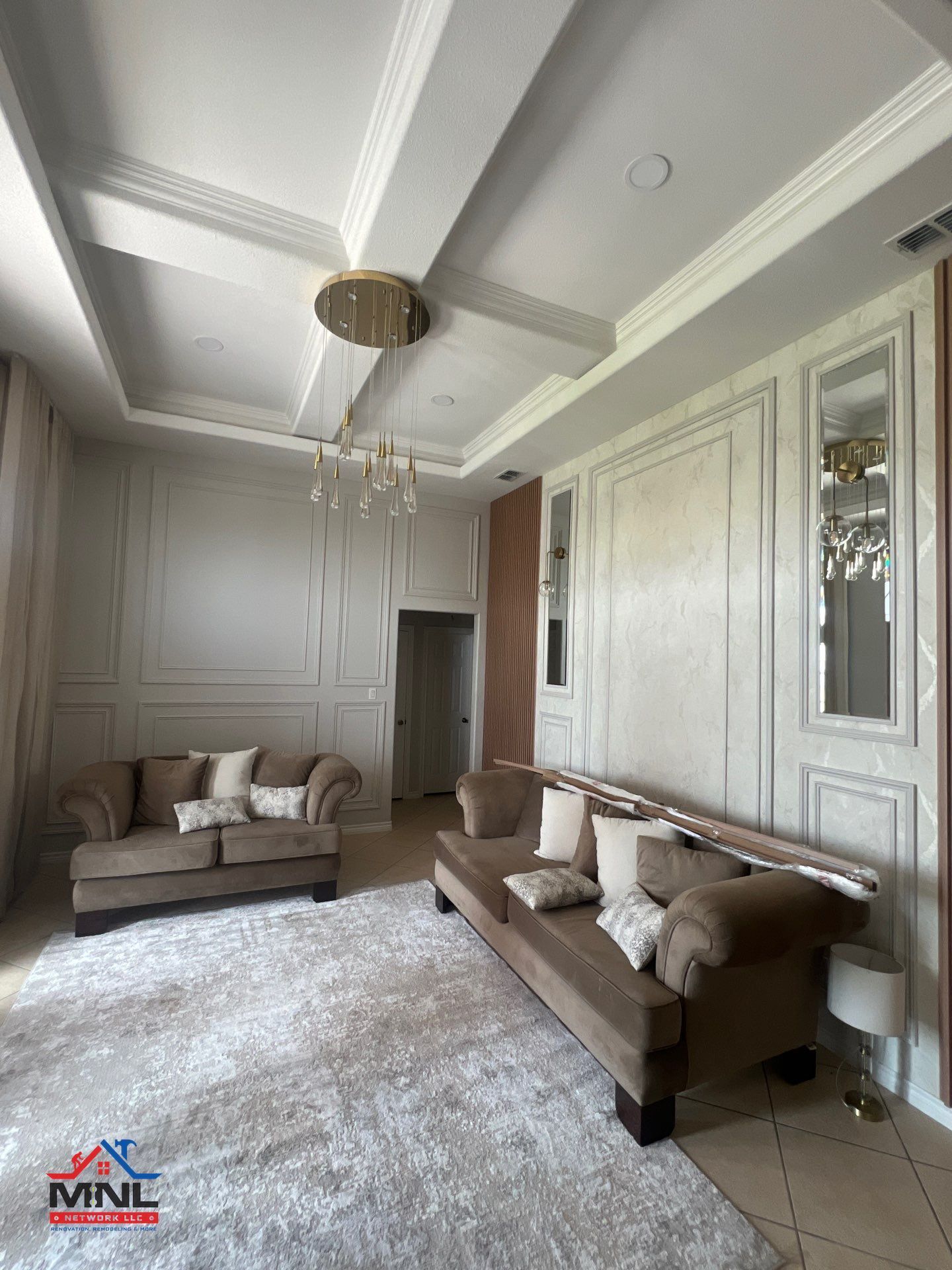 A living room with two couches and a rug.