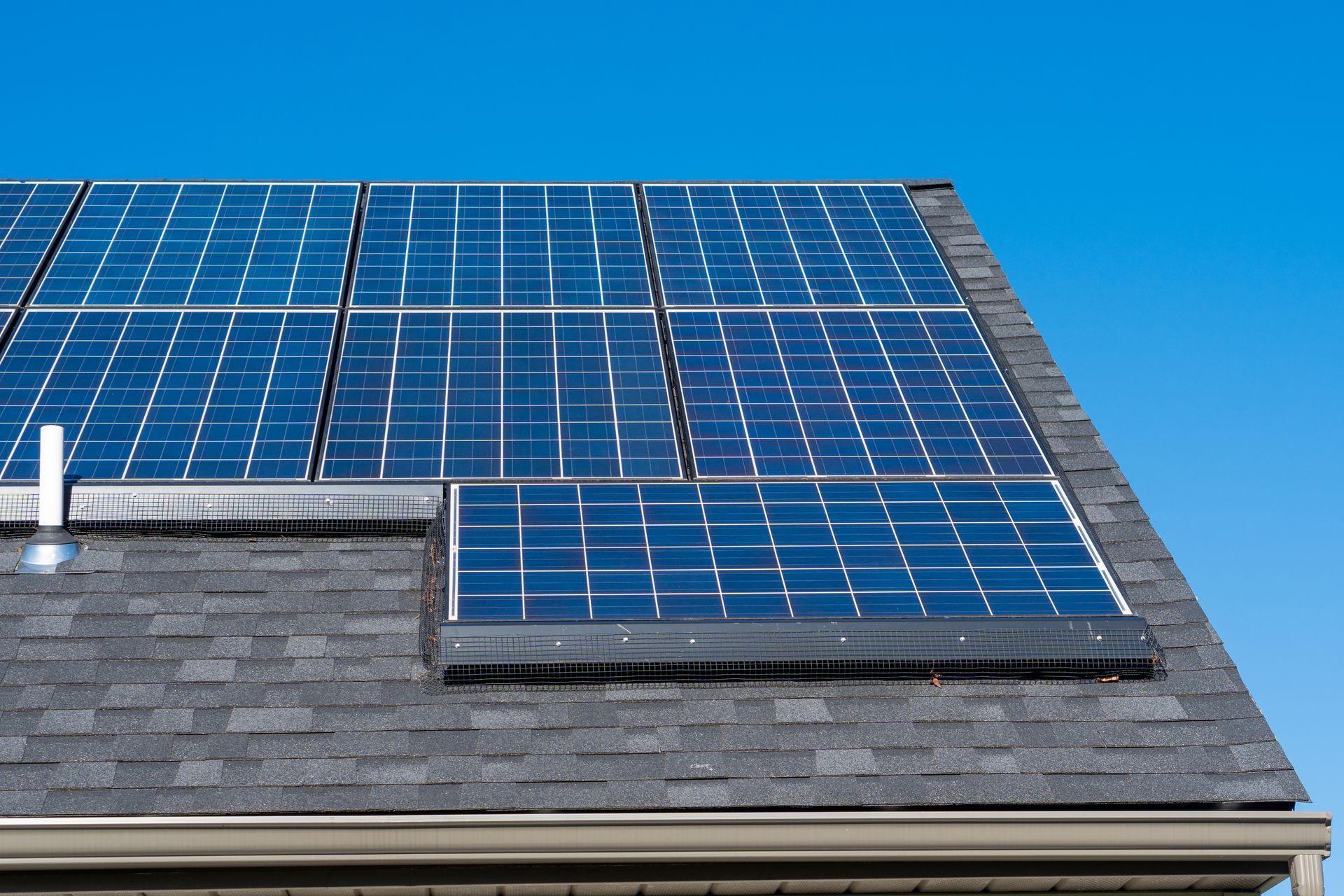 A roof with a lot of solar panels on it