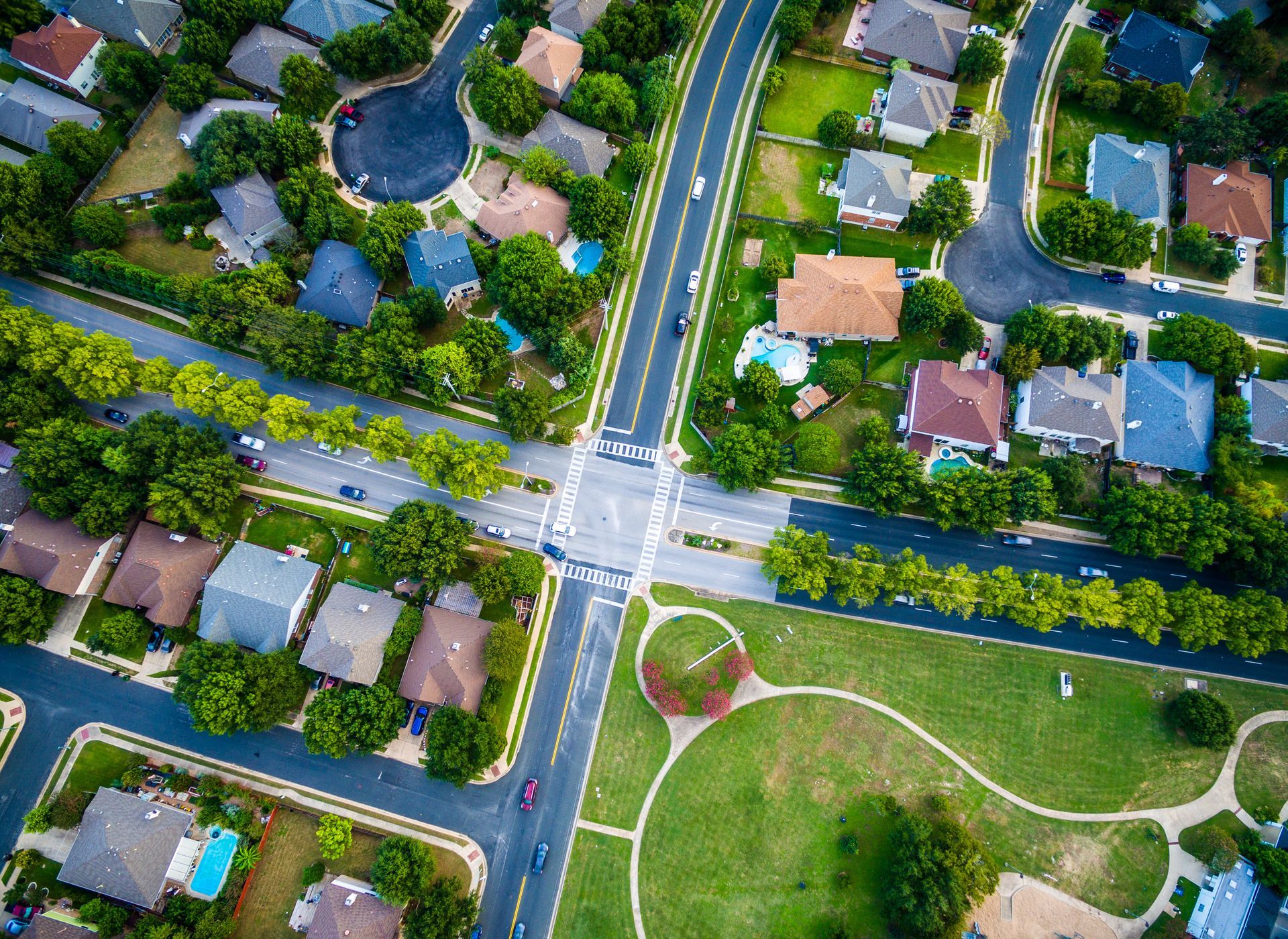 An aerial view of a residential area with lots of houses and trees.