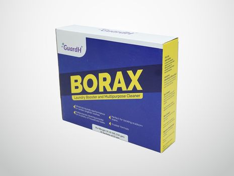 A box of borax is sitting on a white surface.