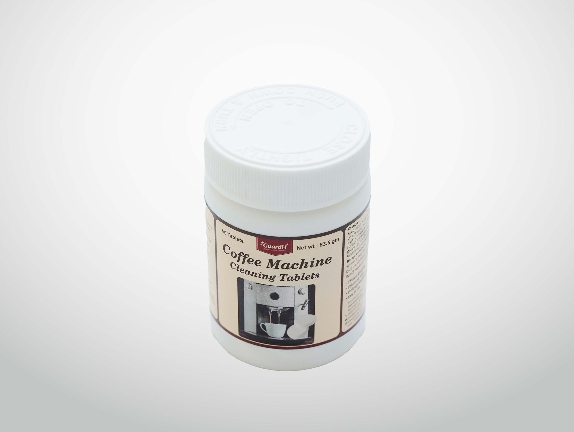 A bottle of coffee machine cleaning tablets with a picture of a coffee machine on the label.