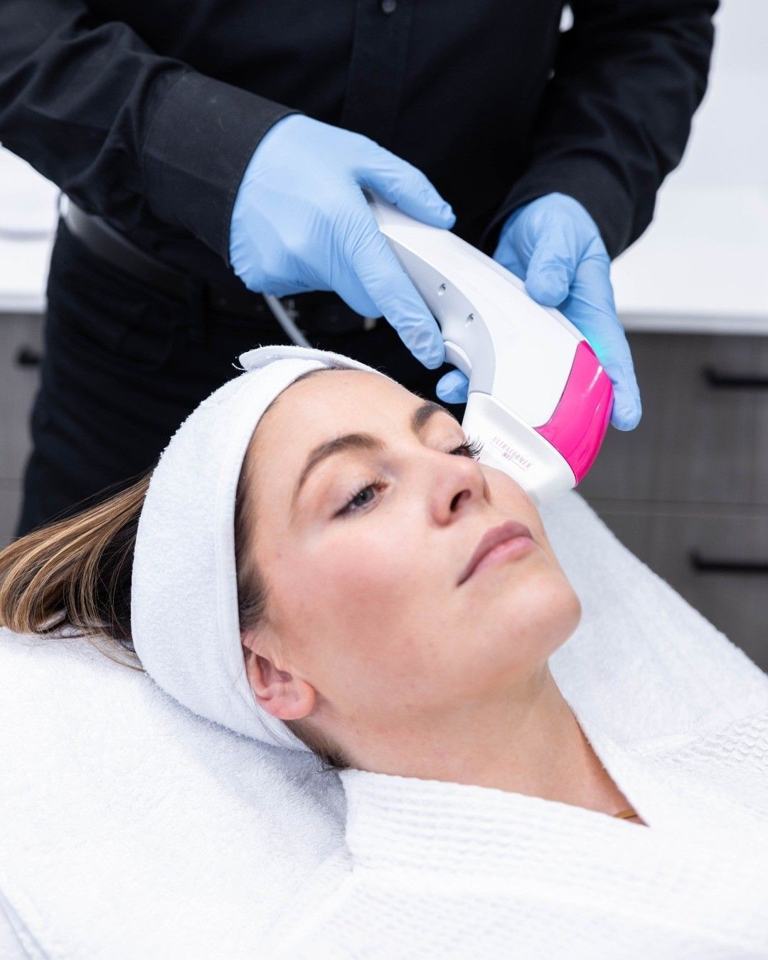 A Woman Is Getting a Laser Treatment on Her Face — Kelamy Skin Clinic in Kiama, NSW