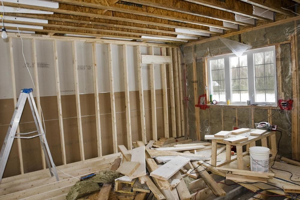 A Room is Being Built With Wooden Beams and a Ladder — Cutting Edge Painting Contractors QLD in The Dawn, QLD