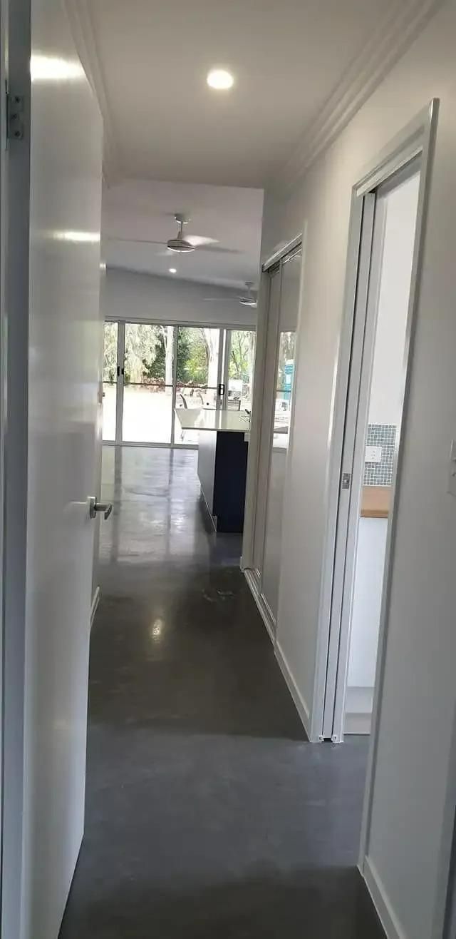 A Hallway in a House With White Walls and a Ceiling Fan — Cutting Edge Painting Contractors QLD in Gympie Southside, QLD