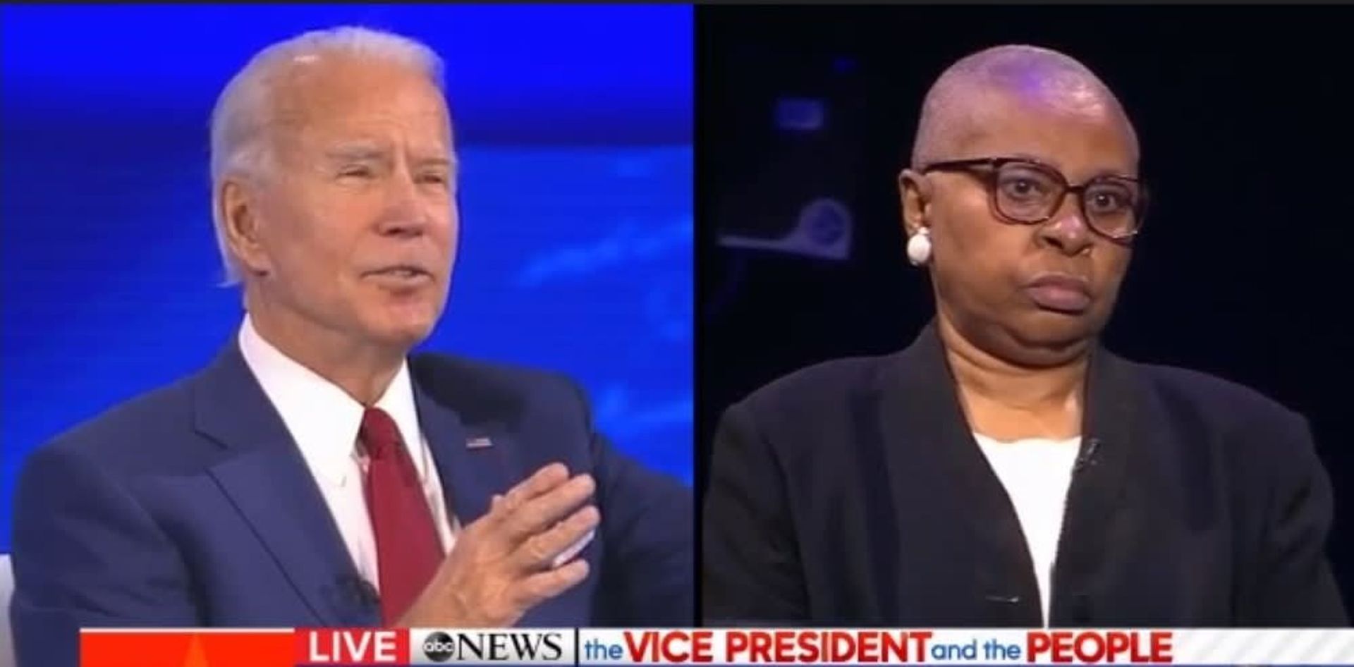 Joe Biden and a woman with glasses during a television interview. 