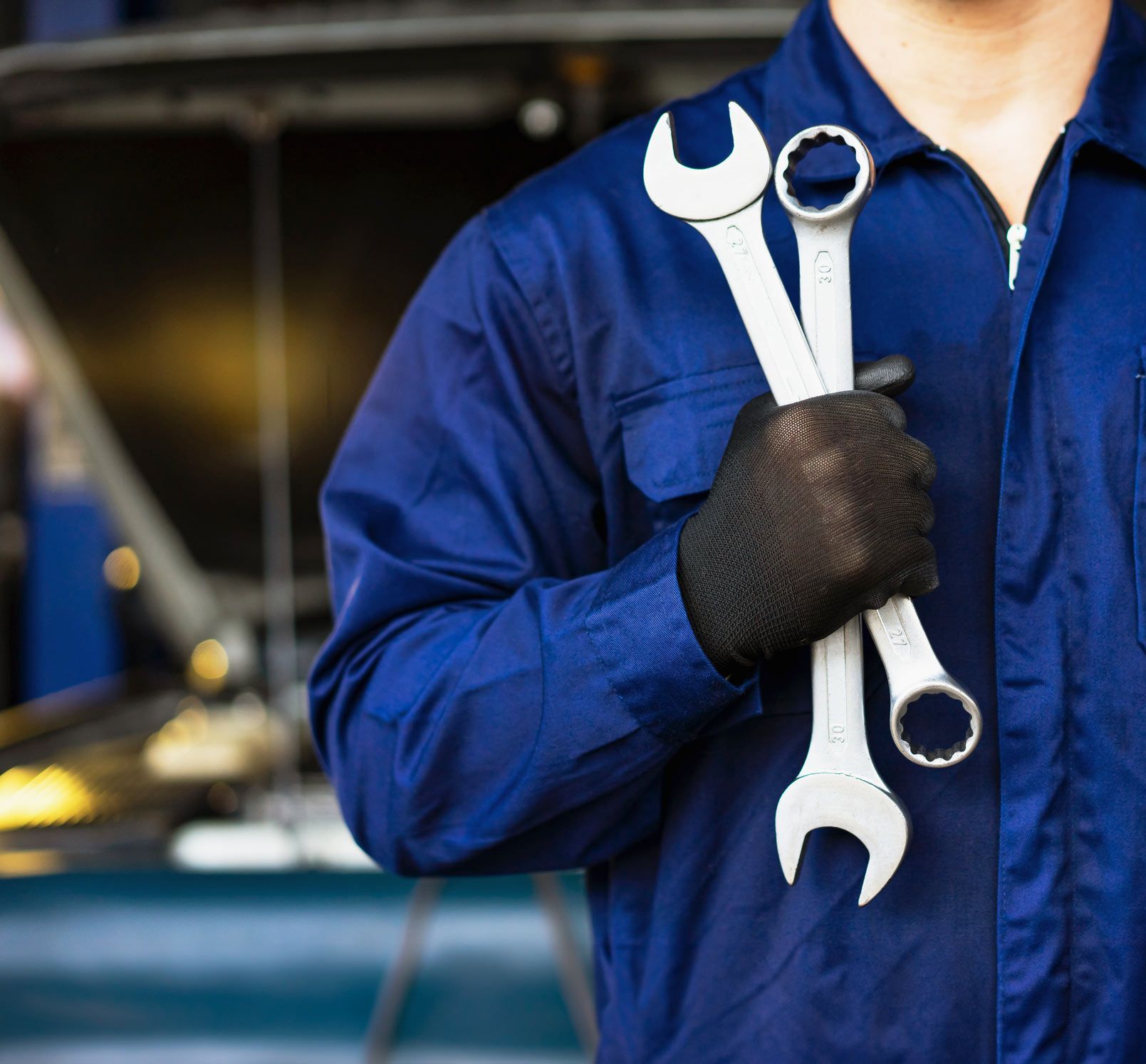 Man Holding Wrenches — Los Angeles, CA — Rv Radiator & Muffler Inc