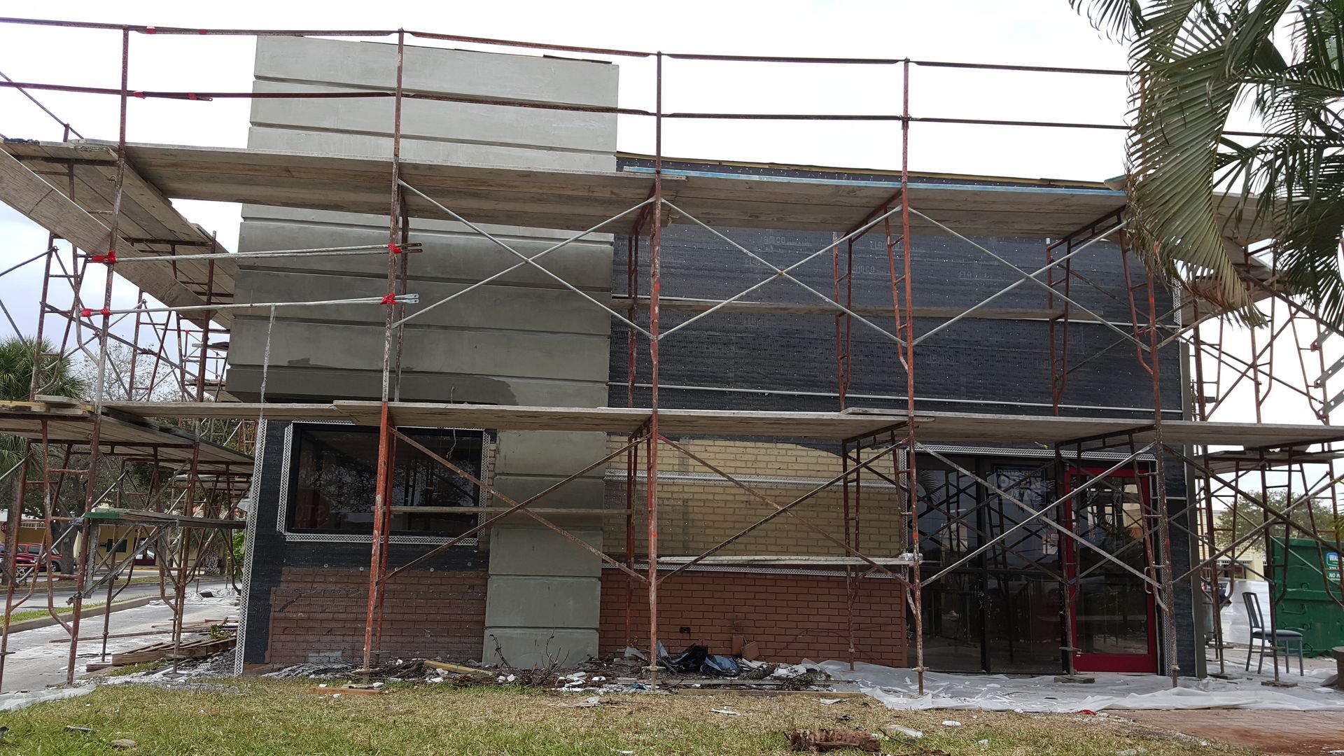 A building under construction with scaffolding around it