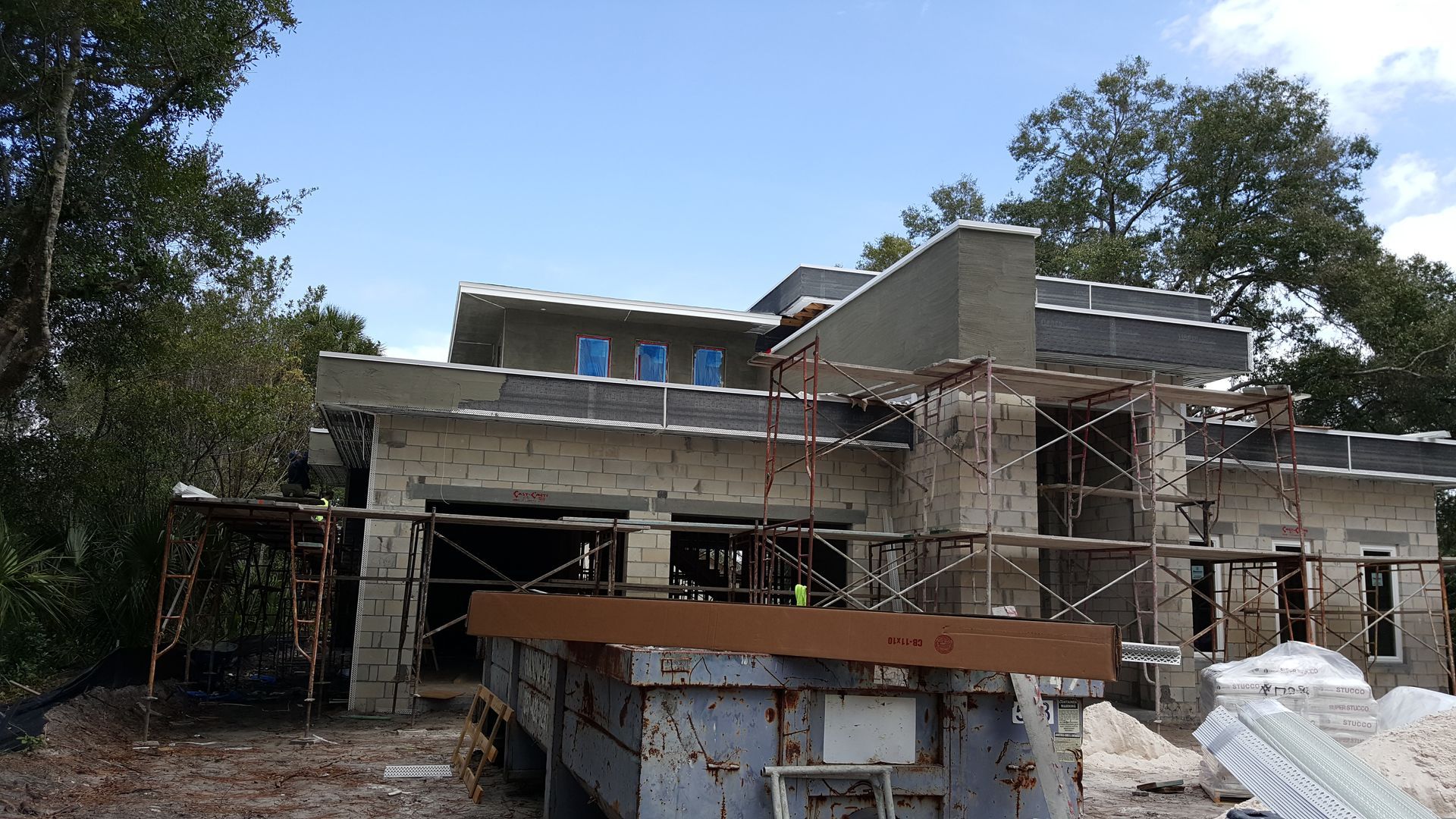 A house that is being built with scaffolding around it