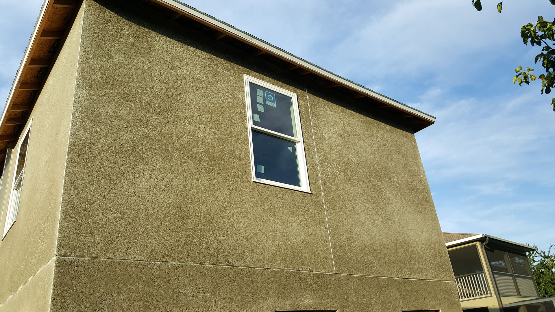 A house with a window on the side of it