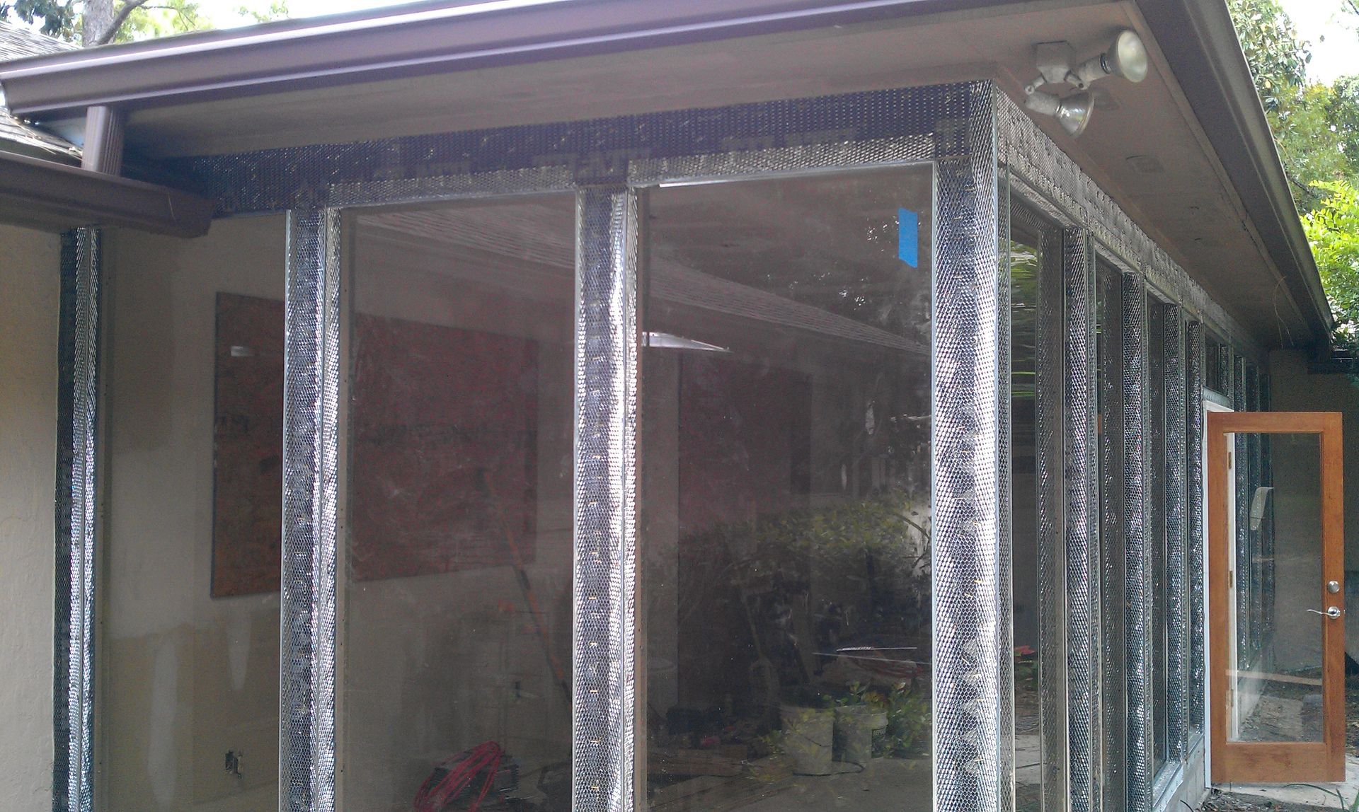 A house with a lot of windows and a door