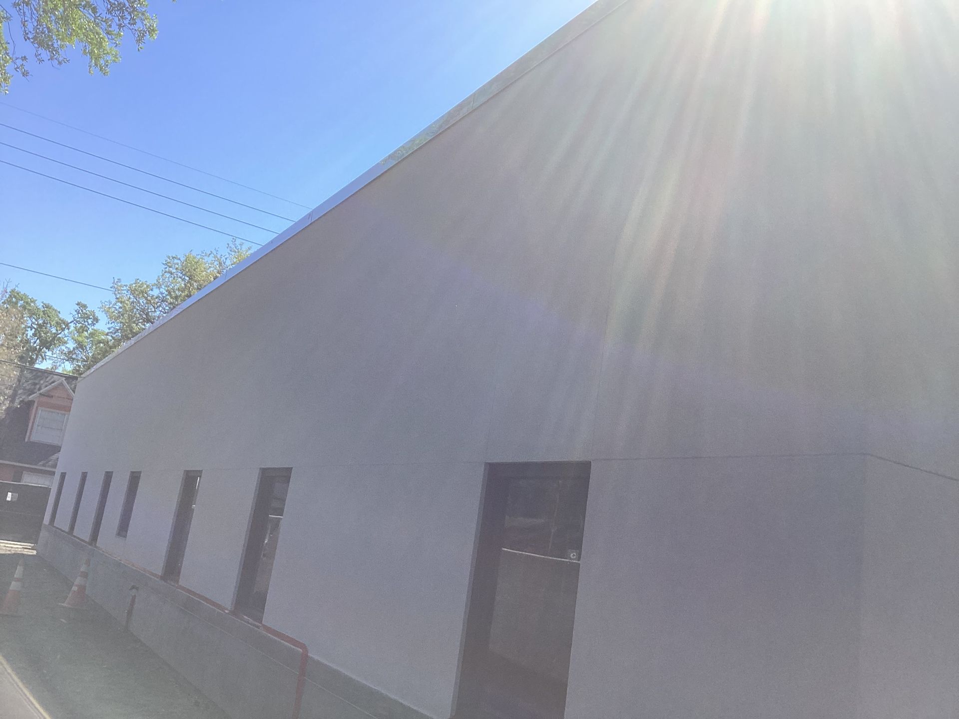 The sun is shining through the windows of a building.