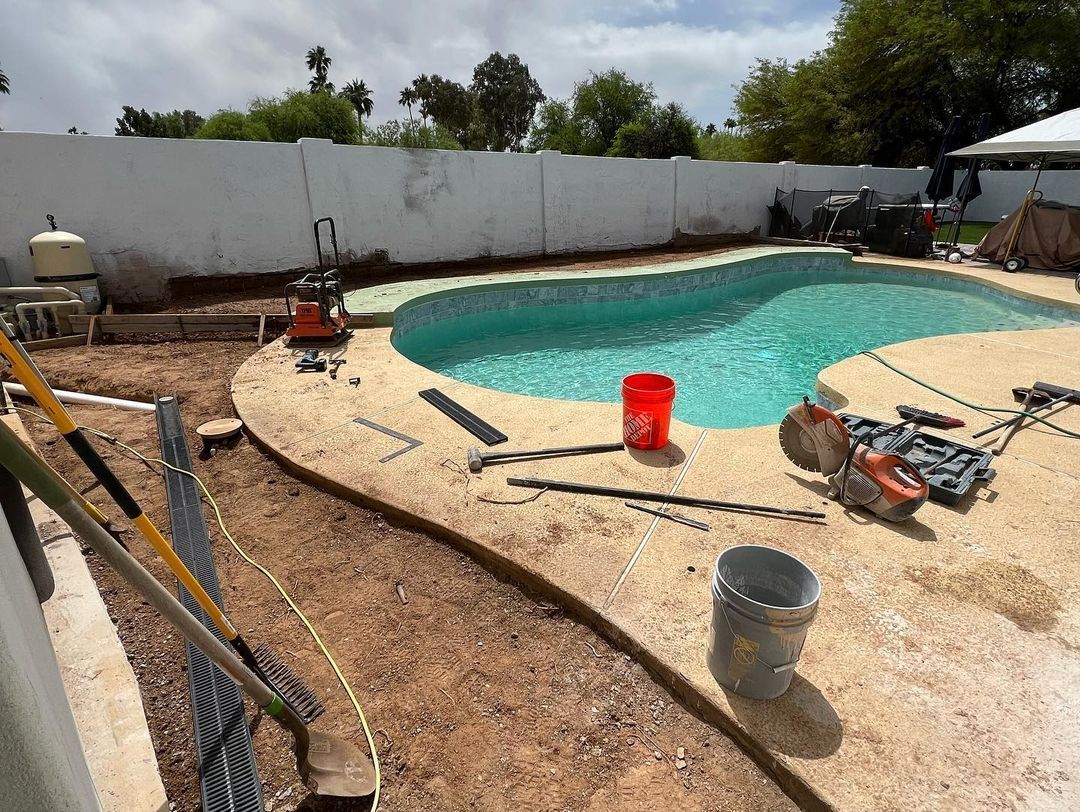 A swimming pool is being built in a backyard.