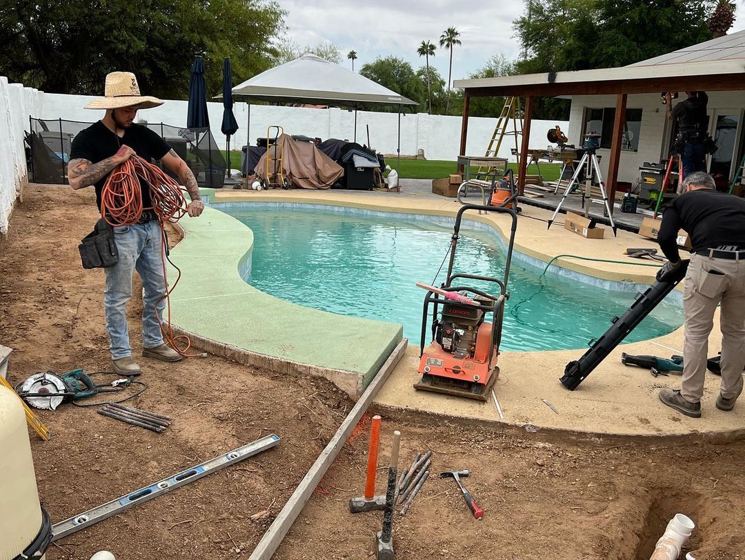 A group of men are working on a swimming pool.