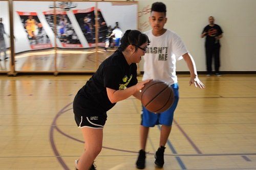 A boy wearing a shirt that says 