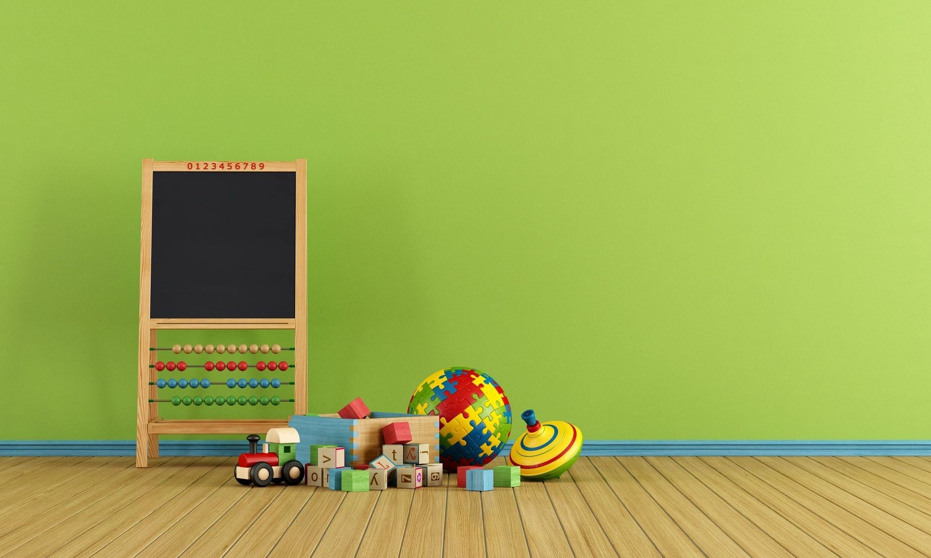 A room with toys , a chalkboard , and a green wall.