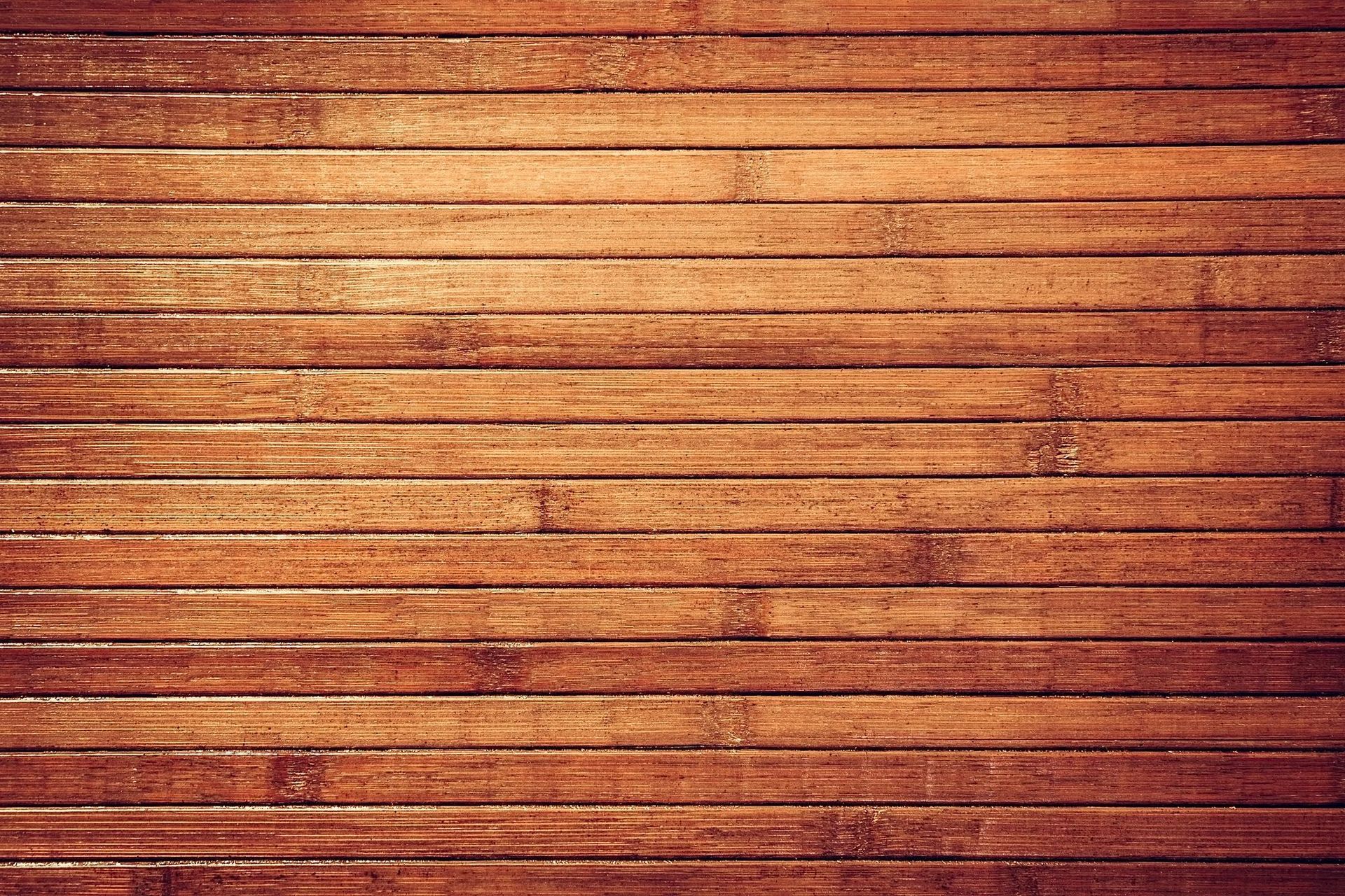 A close up of a wooden wall with a striped pattern.