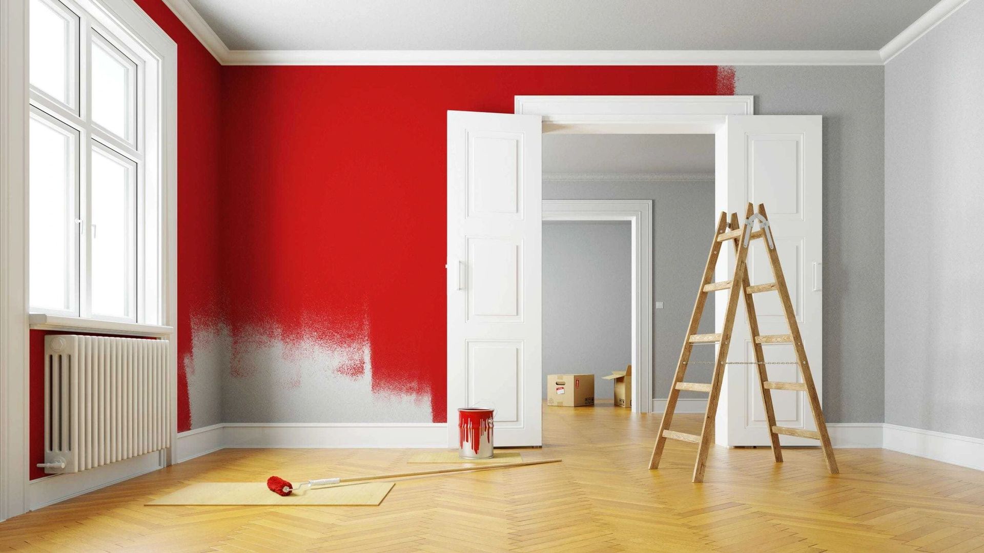 An empty room with red walls and a ladder.