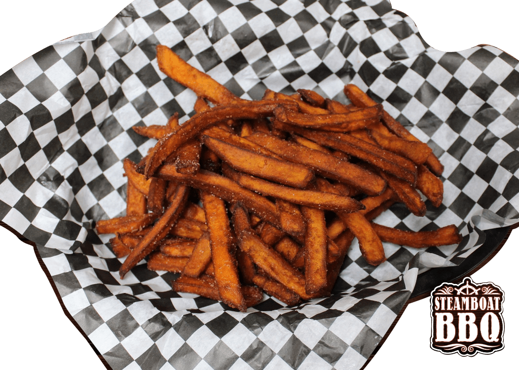 A basket of french fries is sitting on a checkered paper