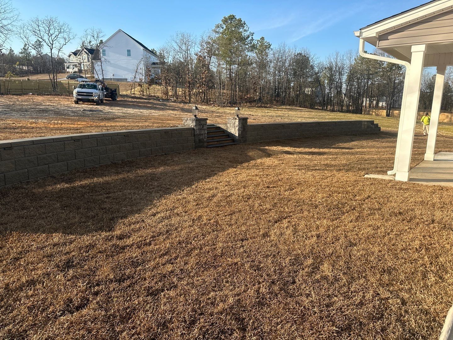 a fence with lights on it is lit up at night .