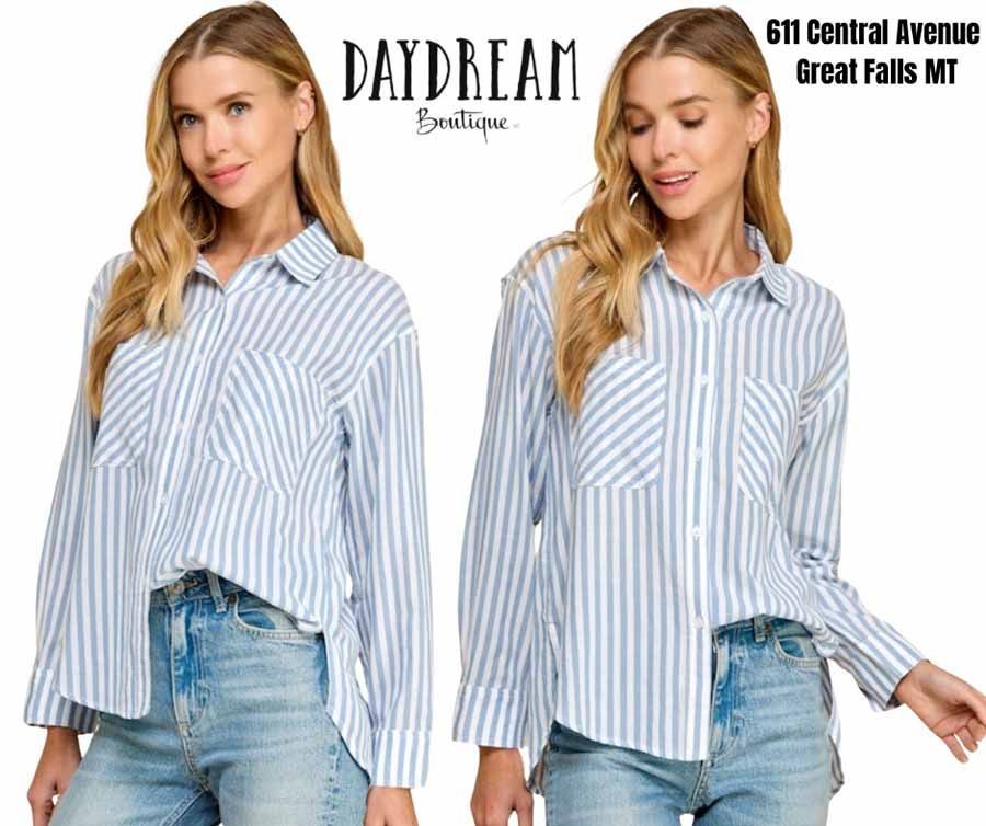 Two women wearing blue striped shirts and jeans. The sign for Daydream Boutique, Great Falls, MT, is at the top.