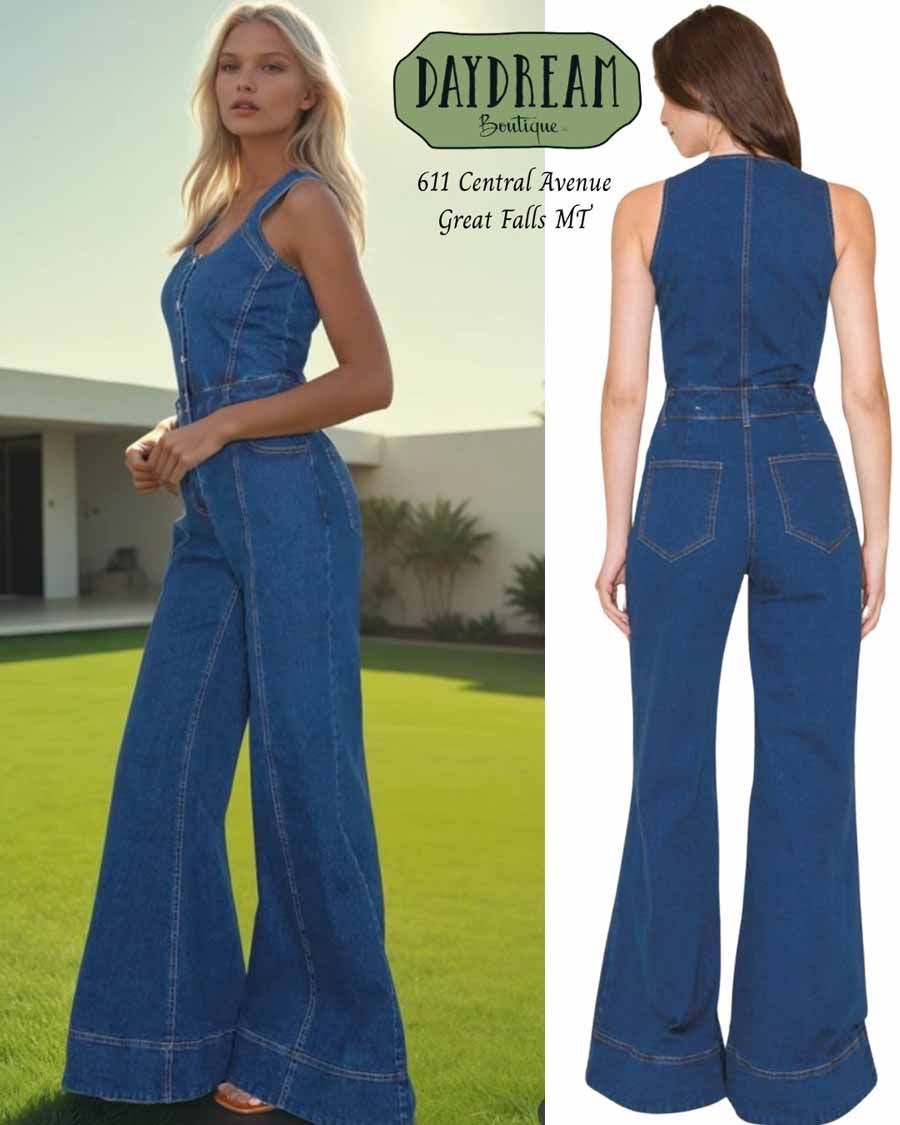 A woman models a denim jumpsuit. Front and back views. Dark blue, wide legs, buttoned bodice. Green grass background.