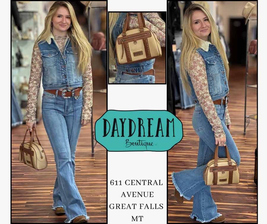 Woman in denim outfit poses with a purse, store logo 