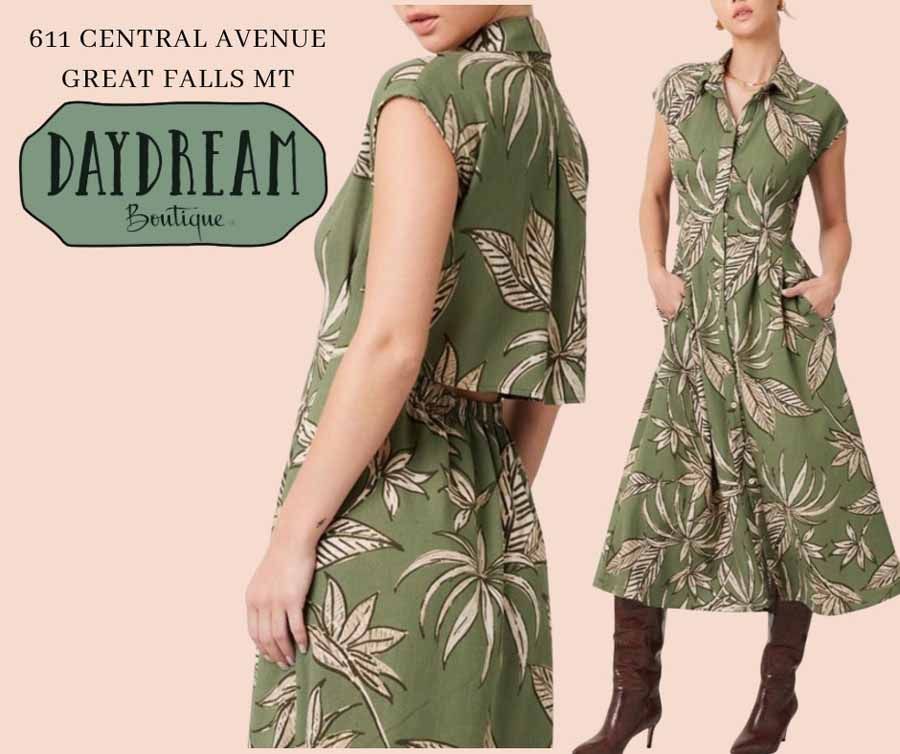 Woman in olive green floral dress, Daydream Boutique, Great Falls MT. Dress has collar, pockets, and is knee-length.